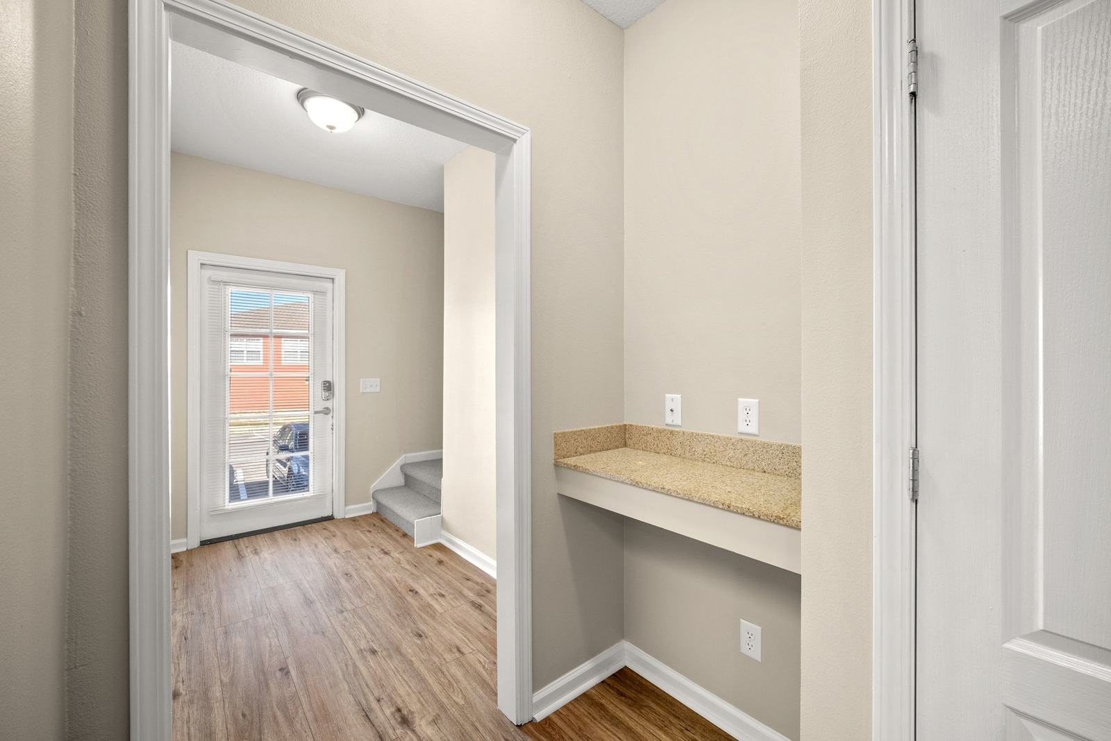 Built-in granite desk nook near the front entry